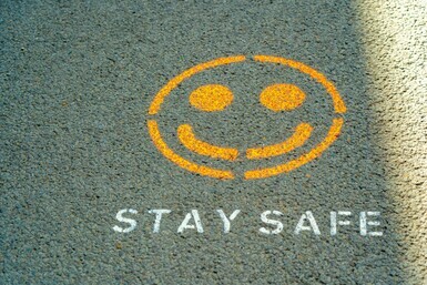image with smiley face that says "Stay safe"