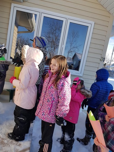 Students singing Christmas carols.