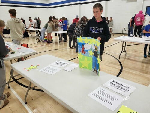 Student looks on at math puzzle.