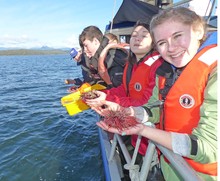 Brant Christian School students prepare to return their 'homework' back to the sea after finishing their studies.