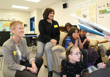 Brenda Beaudette and Terry Davies, from Upper Canada School District, meet with students at Arrowwood Community School.