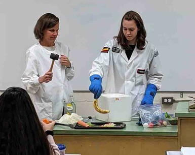 SarahAnn Walker, and her mother Kelcey at left, conduct some experiments with liquid nitrogen for club members.