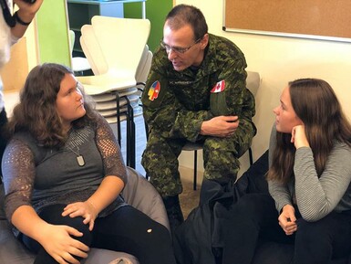 Kate Andrews High School students meet with Canadian soldiers while on an international exchange program in Ukraine.