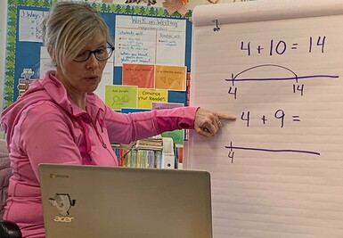 A Vulcan Prairieview Elementary School teacherproduces an instructional video to be shared with students at home.