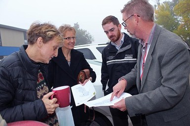 Dan Ryder, at far right, looks over a map of Hutterite colony schools in Palliser Regional Schools with participants of a recent ride-along, including substitute teacher Jean Brochu, at right.