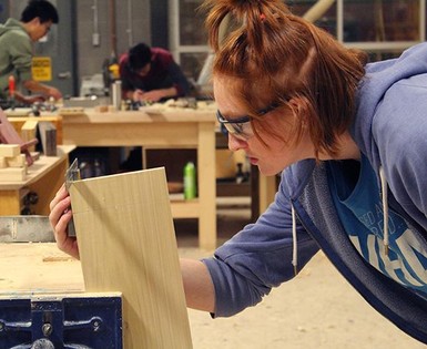 Juliana Bruyn of Master's College checks out her project in the Pre-Employment Carpentry dual-credit program.