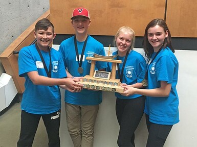 The Junior High Division winners from Champion School with trophy, left to right: Hayden Meadows, Elmore Bueckert, Arianna Groves, Dana Beagle.