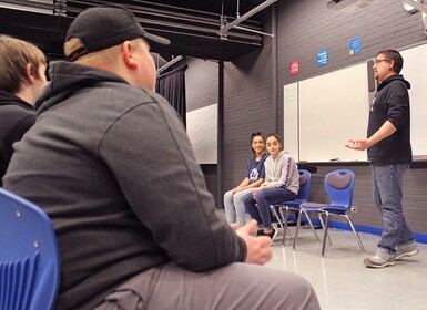 Micheal Ward, from right to left, Jalila and Hiba field questions from Picture Butte High School students during a presentation on immigration and refugees.