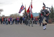 Piper Ryan Calvank leads the colour party and students from Coalhurst High School and Coalhurst Elementary School to the community Cenotaph as part of the 100th anniversary commemoration of the Battle of Vimy Ridge.