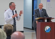 Kate Andrews High School Principal Harry Fritschy, left, addresses a question from the crowd while Acting Superintendent Dr. Garry Andrews looks on.
