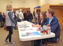 Champion School students accepting donations at the Palliser Regional Schools professional development Summit at Country Central High School in Vulcan.