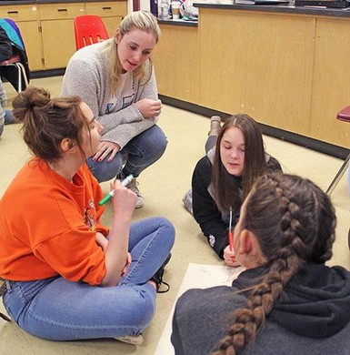 Workshop facilitator Shelby Dorfman works with students to come up with an action plan for an awareness/fundraising project.