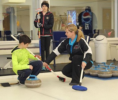 Tammy Lahd provides a student with a few tips at the Milo Community School's annual Fun Spiel.