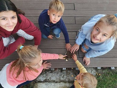 Kate Andrews High School student Isabella Jackson, top left corner, with members of her host family in Ukraine.